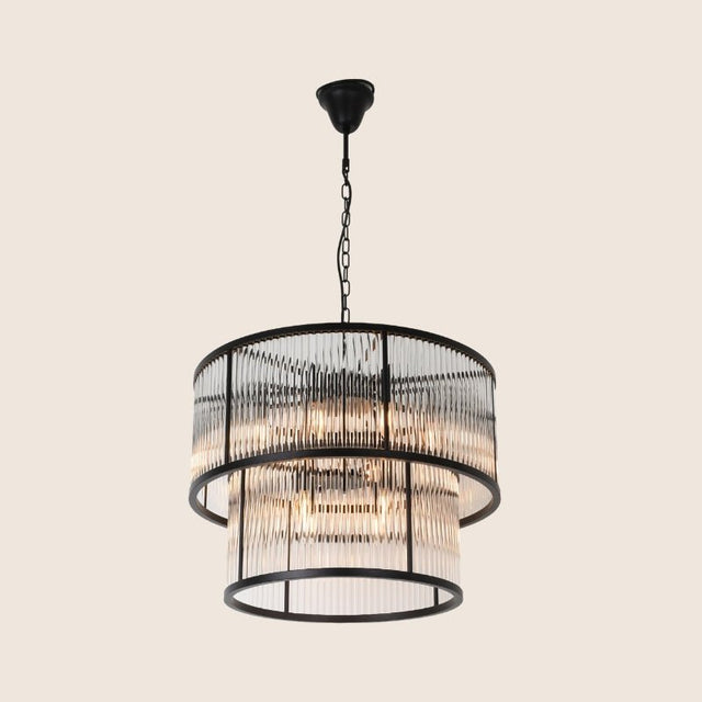 "A detailed view of a round chandelier featuring ribbed glass panels and a sturdy iron frame, showcasing its modern industrial design."