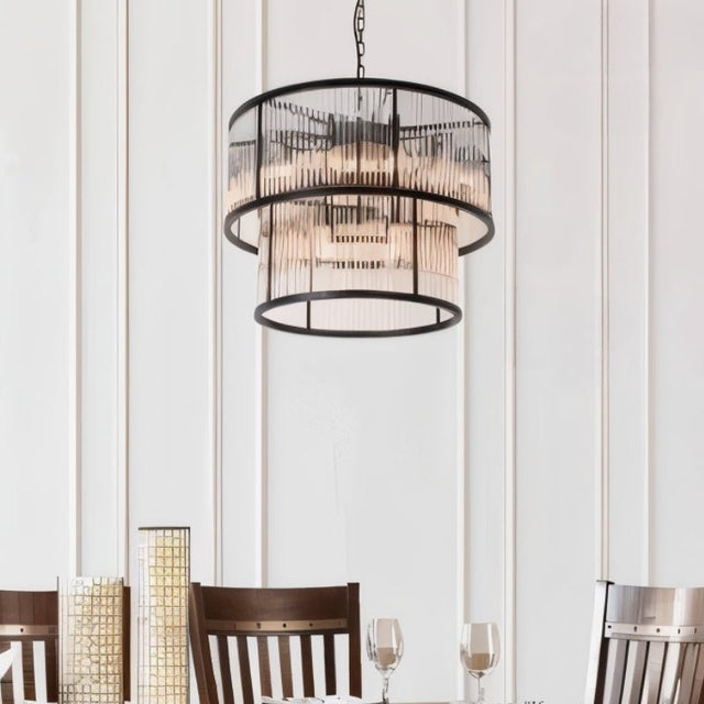"A modern two-tiered chandelier with an iron frame and ribbed glass panels, elegantly hanging over a dining table, providing soft ambient lighting."