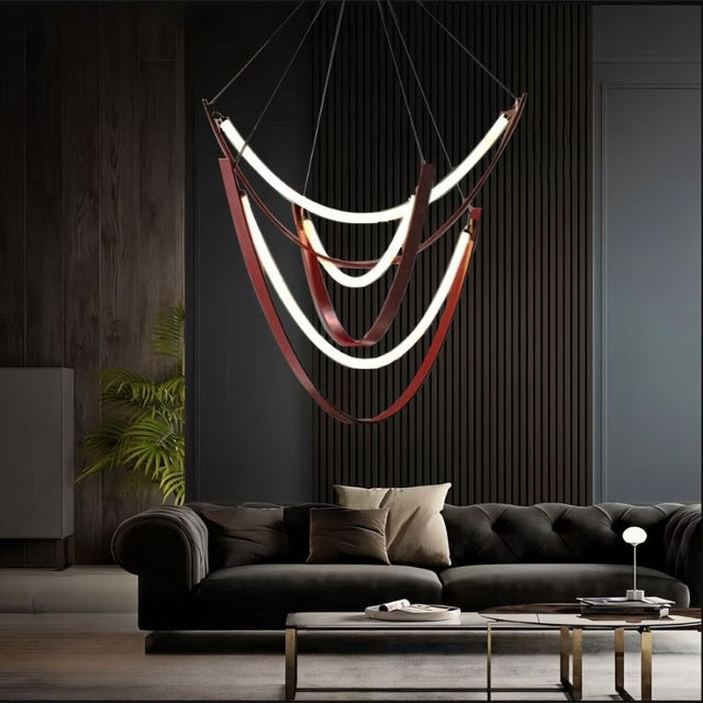 "Contemporary chandelier with layered glass arcs and leather straps, creating depth and warmth in a luxurious living room."