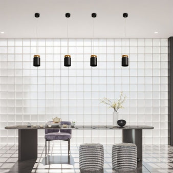 "Modern dining area with minimalist aluminum pendant lights, black and gold accents, focused ceiling lighting"