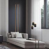 "Cozy living space with suspended aluminum pendant lights, black and gold finish, modern interior lighting"