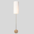 "Wooden spherical base detail, minimalist floor lamp, ambient lighting fixture."