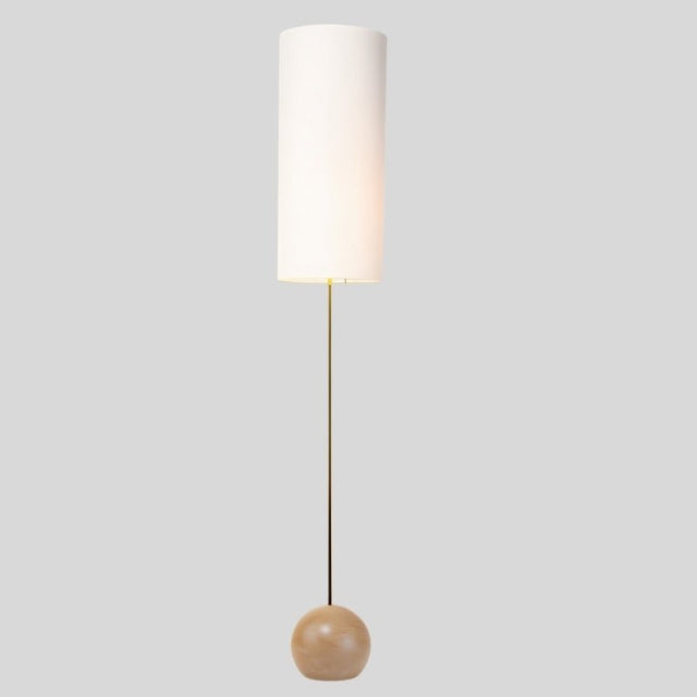 "Wooden spherical base detail, minimalist floor lamp, ambient lighting fixture."
