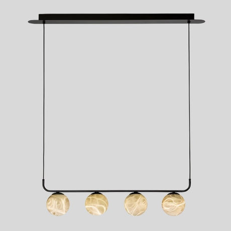 "Front view of the Ostra pendant lamp with four alabaster and aluminum spheres suspended from a sleek black frame, adding a contemporary touch to modern interiors."