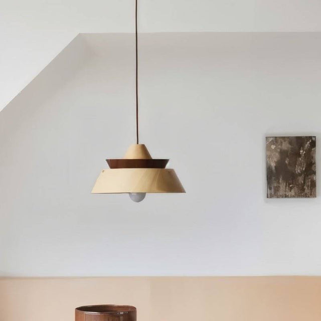 "Wooden pendant light featuring a minimalist layered design, ideal for creating a warm and cozy atmosphere in contemporary spaces."