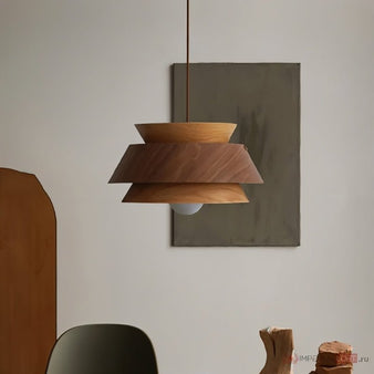 "Sleek wooden pendant light with layered design, emitting a warm ambient glow, perfect for modern and Scandinavian interiors."