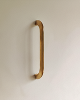 Enzo Cabinet Pull 6" in Unlacquered Brass, on a plain background