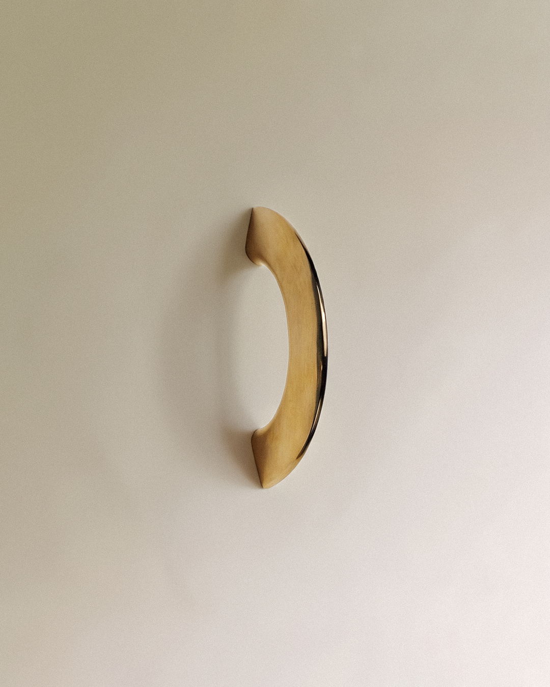 Enzo Cabinet Pull 2" in Unlacquered Brass, on a plain background