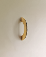 Enzo Cabinet Pull 2" in Unlacquered Brass, on a plain background