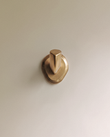 Enzo Wall Hook in Satin Brass, on a plain background