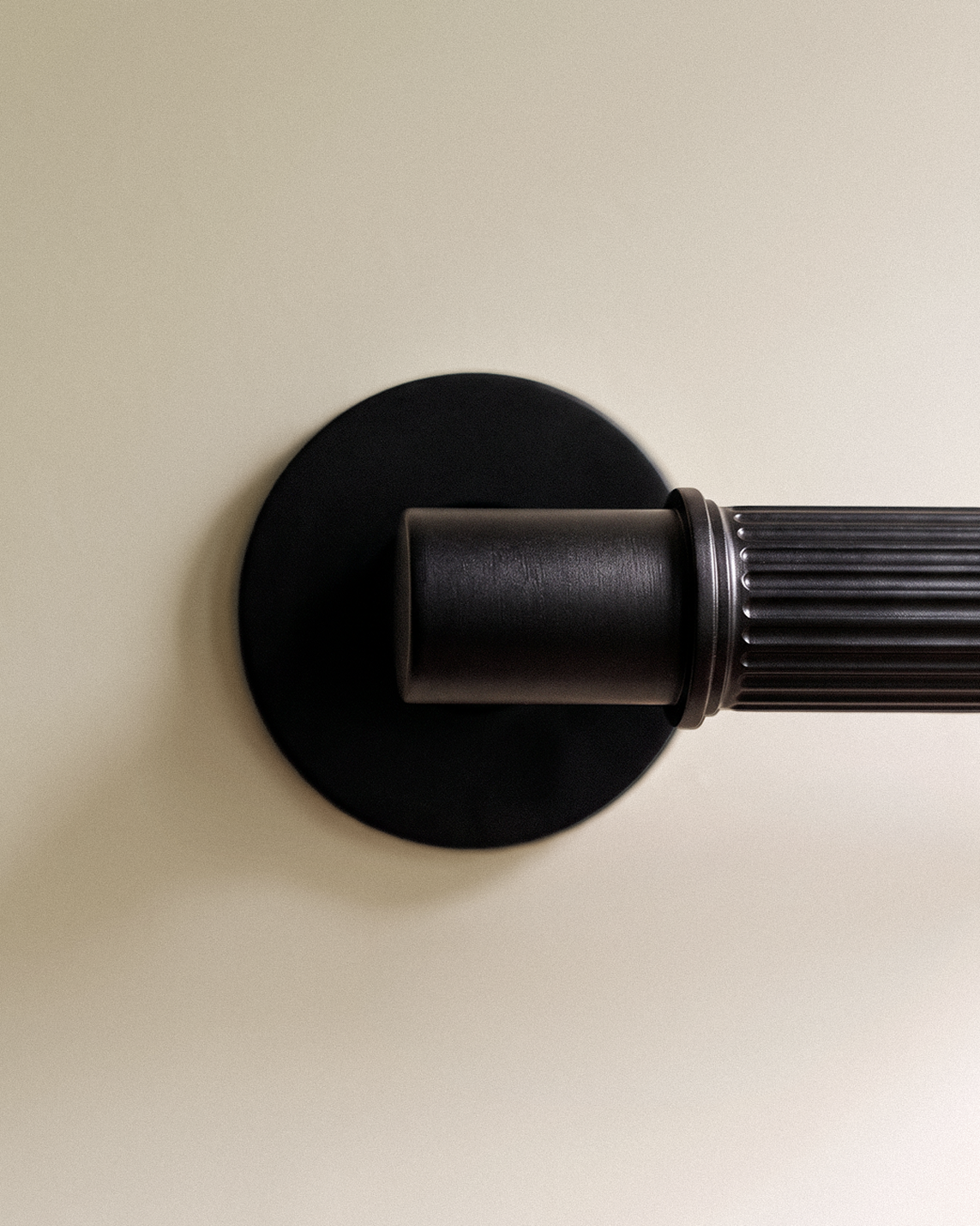Vestige Door Handle in Satin Brass, on a plain background