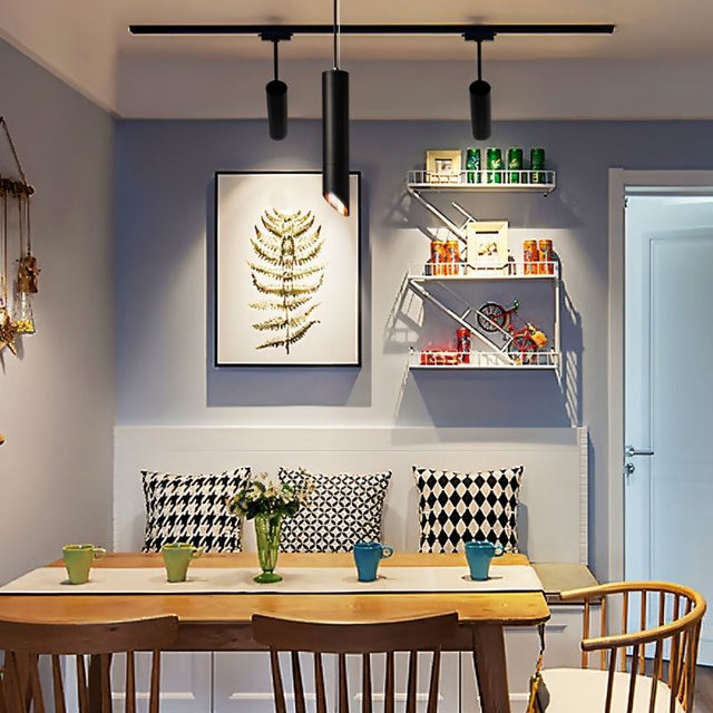 "Pendant light fixture above dining table, black cylindrical design, ambient lighting, aluminum finish, cozy dining setup"