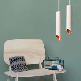 "Modern aluminum pendant light, matte white finish, sleek cylindrical design, directed illumination, cozy room décor"