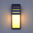 "Modern outdoor wall lamp with horizontal slats, durable aluminum, diffusing soft light in a cozy ambiance."