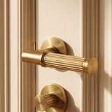 Vestige Door Handle in Satin Brass, styled interior