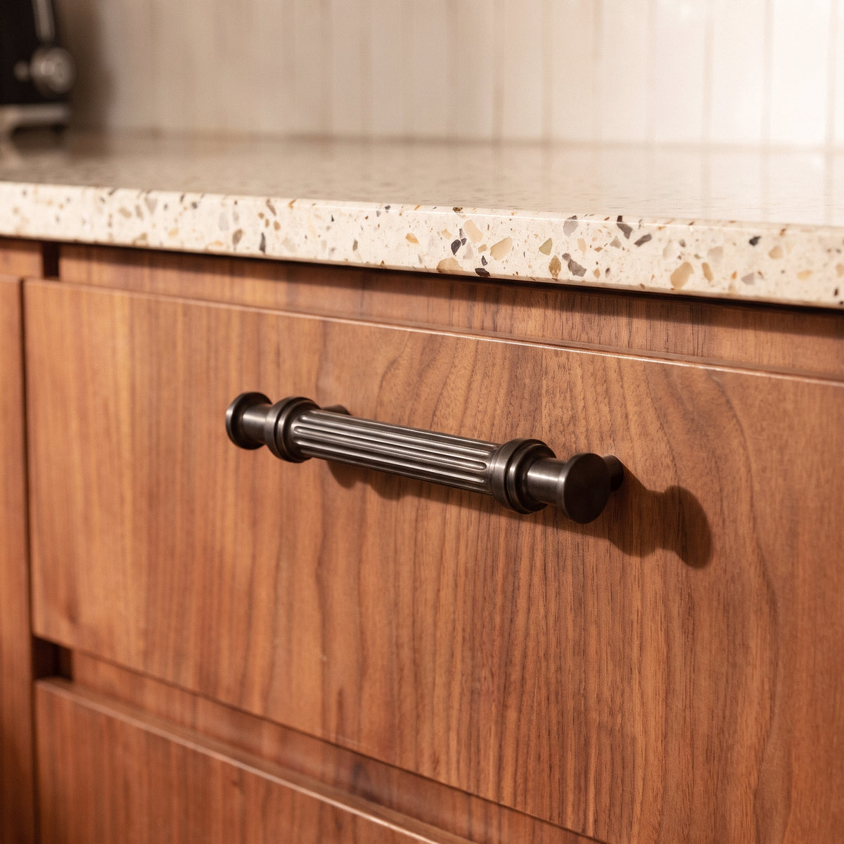 Vestige Cabinet Pull in Satin Brass, styled interior