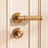 Vestige Door Handle in Satin Brass, styled interior