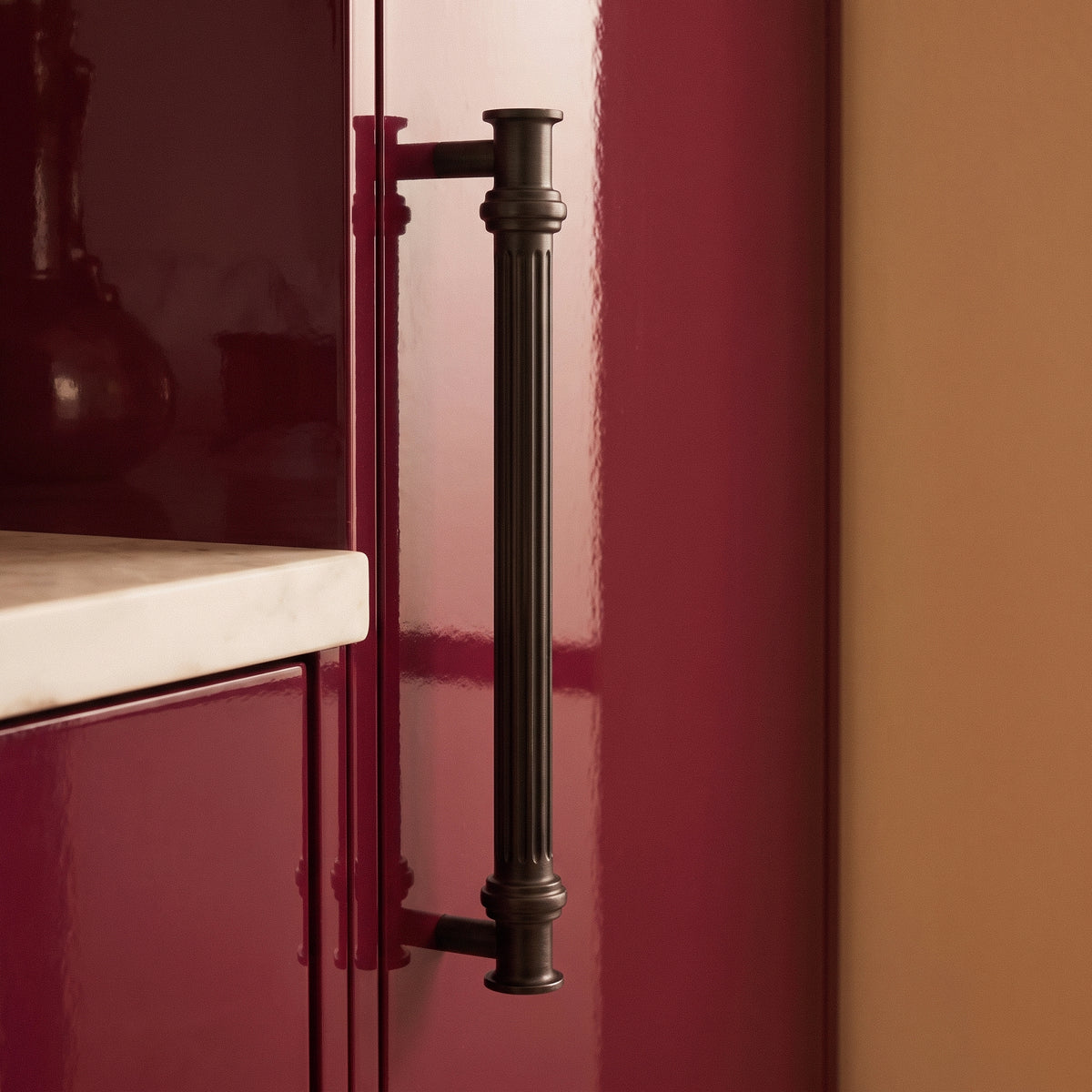 Vestige Cabinet Pull in Satin Brass, styled interior