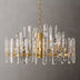 Prizma round chandelier with gold finish and clear crystal prisms, hanging against plain gray background, approximately 24 in