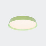 Zena Ceiling Lamp in pastel green with integrated LED, offering a fresh minimalist look for modern dining rooms or office spaces.