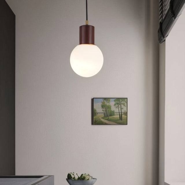 "Modern pendant light featuring sleek spherical design and wooden holder, ideal for dining rooms and kitchens."
