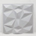 Gray geometric wall panel with multiple triangular facets, measuring approximately 3ft x 3ft, finished in a sleek matte textu