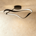 Black cylindrical adjustable ceiling spotlight mounted on wh