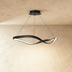 Black textured sculptural bust on illuminated display shelf
