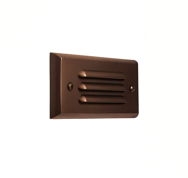 "Close-up view of a sleek, horizontal grille brass step light fixture, made from durable, weather-resistant brass, designed for outdoor lighting applications"