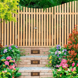 "Brass step lights installed along a garden pathway, enhancing visibility and safety, made from durable weather-resistant brass with a horizontal grille design"