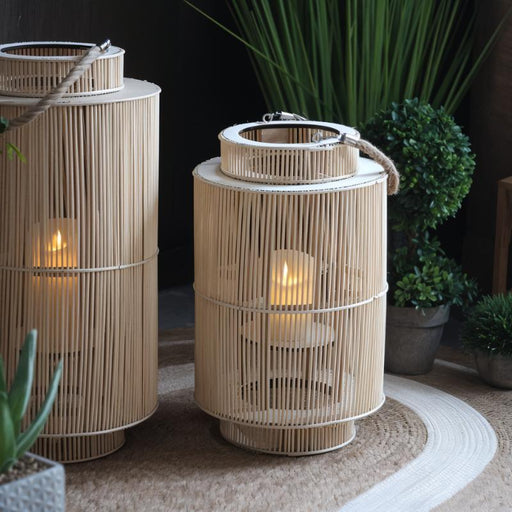 Adara Moroccan Style Floor Lantern: Drawing inspiration from Moroccan design, this floor lantern features colorful glass panels and intricate patterns, creating a mesmerizing play of light and shadow.