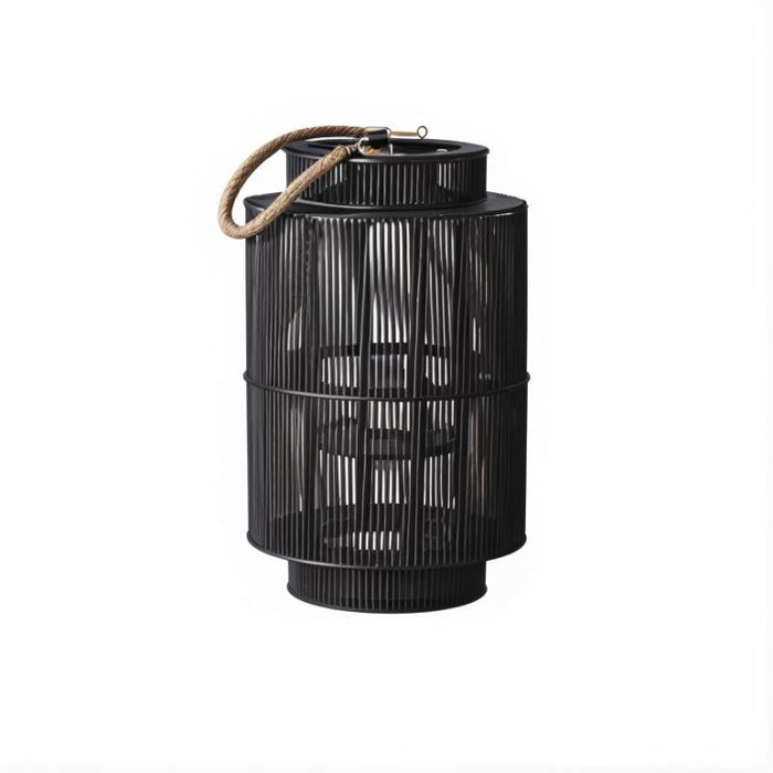 Adara Bohemian Macramé Floor Lantern: Handcrafted with intricate macramé patterns, this floor lantern adds bohemian flair and texture to eclectic interiors, casting beautiful patterns of light and shadow.
