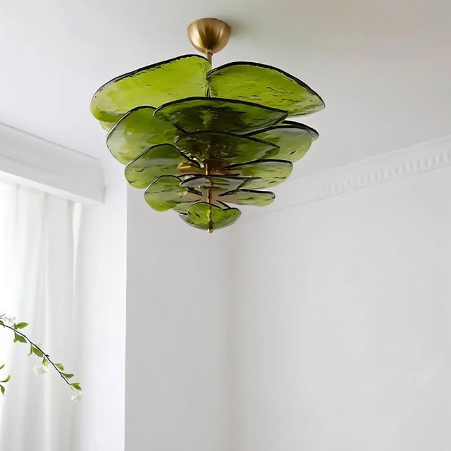 "A green Murano glass chandelier with layered petals, viewed from below against a white ceiling and wall."