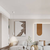 Single Ailis Pendant Light in white elegantly illuminating a modern living room with integrated LED lighting.
