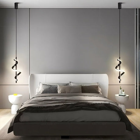 "Two black pendant lights with a spiral design, shown lit up on either side of a bed with gray bedding and a white headboard, in a room with gray walls and modern side tables."