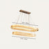 Modern double ring chandelier in gold finish, measuring 35.4" x 27.6", suspended with clear cords against a white background.