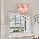 "A Murano glass disc chandelier in a bathroom setting."
