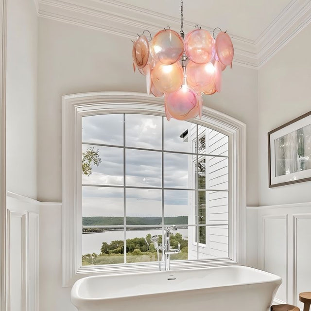 "A Murano glass disc chandelier in a bathroom setting."
