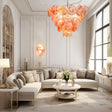 "A Murano glass disc chandelier in a luxurious living room."
