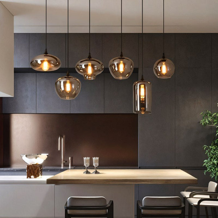 Anaar Modern Glass Pendant Light: Featuring a sleek glass shade and minimalist design, this pendant light adds a contemporary touch to any space.