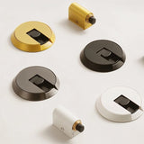 "Modern brass door stops in various colors, including brushed metallic finishes."