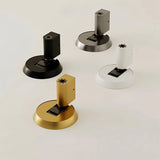 "Modern brass door stops in various finishes, including black, silver, white, and gold."