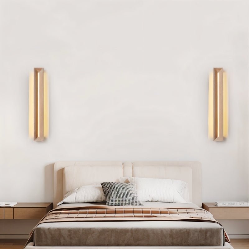 "Elegant travertine wall lamps in a bedroom, providing soft, warm light with a minimalist design that complements modern decor."