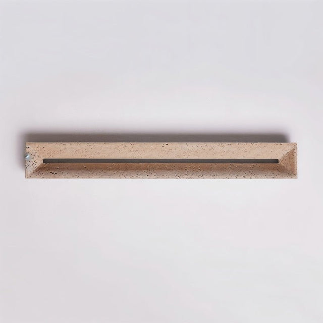 "Top view of a travertine wall lamp with a sleek design, perfect for adding a touch of minimalist elegance to any interior."