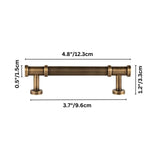 "Dimensions of an antique brass fluted pull bar with detailed end caps and a ribbed texture."
