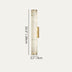 Tall cylindrical alabaster wall lamp with brass accents shown with dimensions against a neutral background.