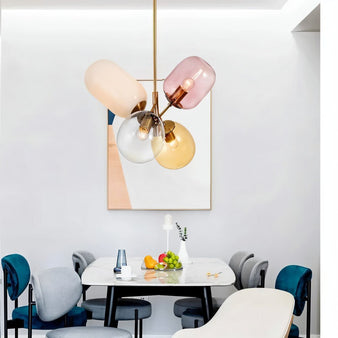  "Modern pendant light with clustered asymmetrical glass shades in a contemporary living room."