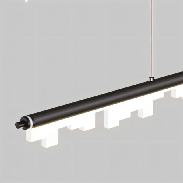 "Close-up of a linear pendant light showing the sleek aluminum frame and geometric acrylic diffusers, highlighting its modern design."