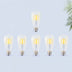 Six Edison-style LED filament bulbs with warm yellow glow displayed against a light blue background.