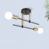 Two-light ceiling fixture with black and brass finish and frosted glass globes mounted on white wall.